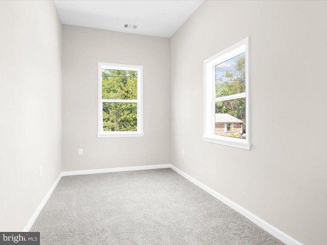 unfurnished room with carpet floors