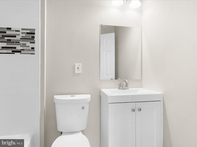 full bathroom featuring vanity, shower with separate bathtub, and toilet