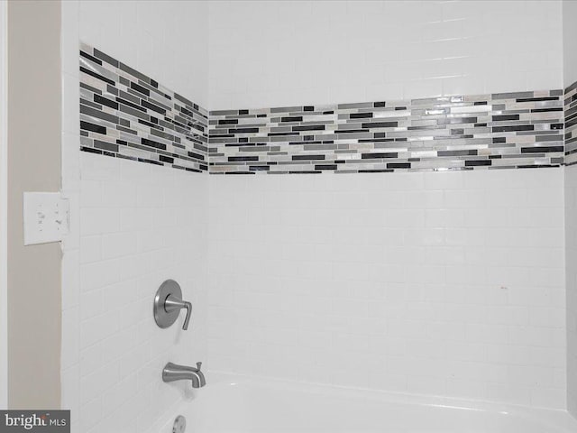 details with tiled shower / bath combo