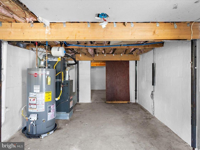 basement featuring gas water heater and heating unit