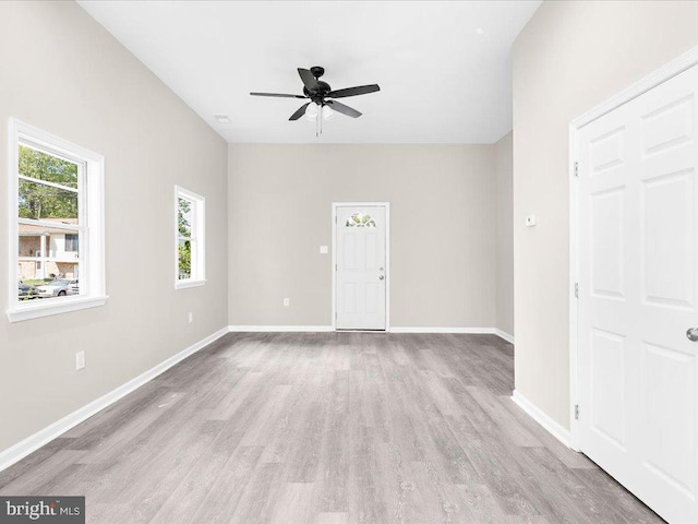 unfurnished room featuring light hardwood / wood-style floors and ceiling fan