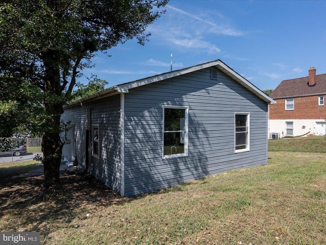 view of side of home featuring a yard