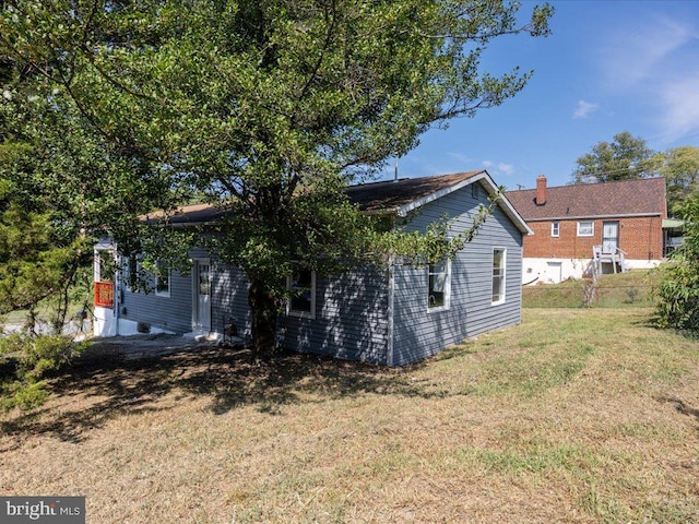 exterior space with a lawn