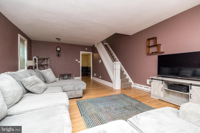 living room featuring light hardwood / wood-style floors and baseboard heating