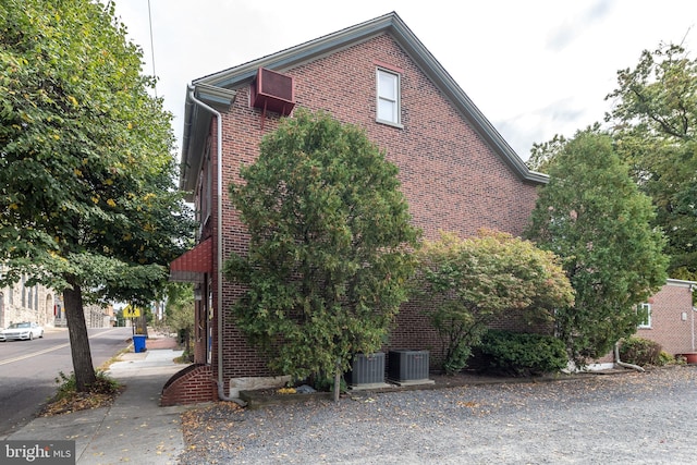 view of side of property with central AC unit