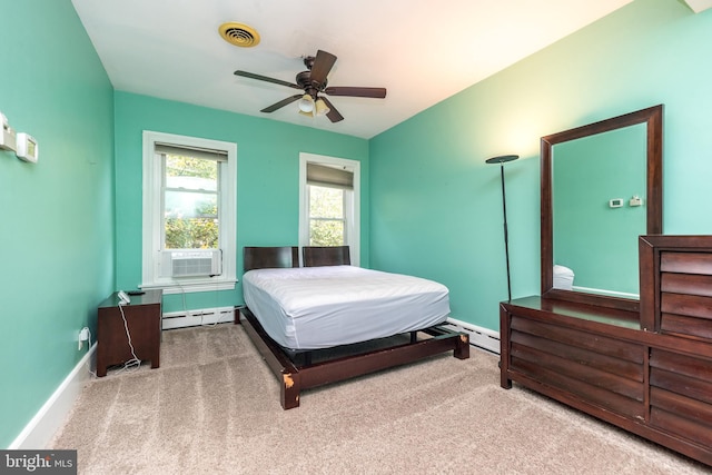 carpeted bedroom featuring cooling unit, baseboard heating, and ceiling fan