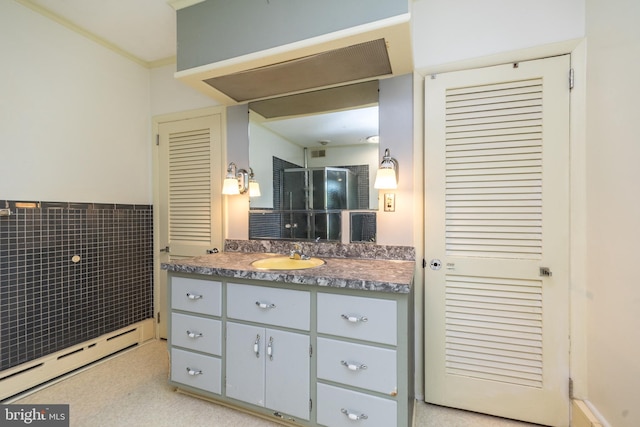 bathroom with vanity and a baseboard radiator