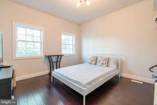 bedroom featuring dark hardwood / wood-style floors