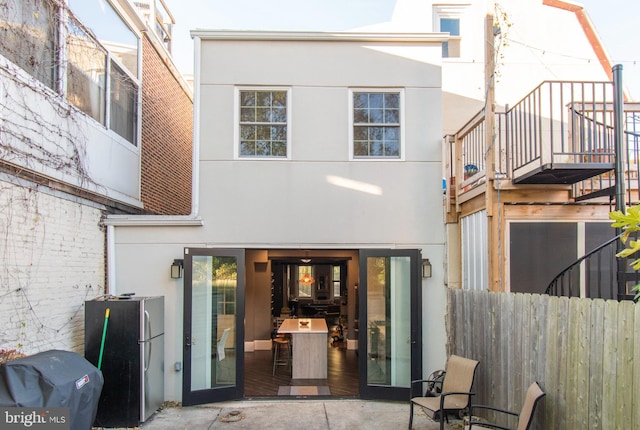 rear view of house featuring a patio