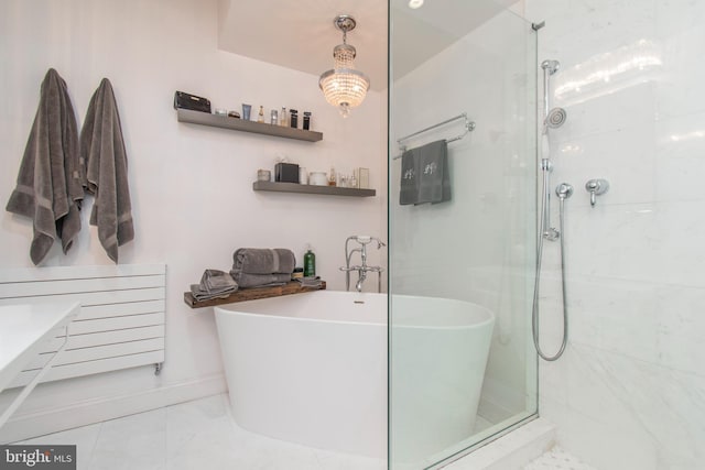 bathroom featuring separate shower and tub