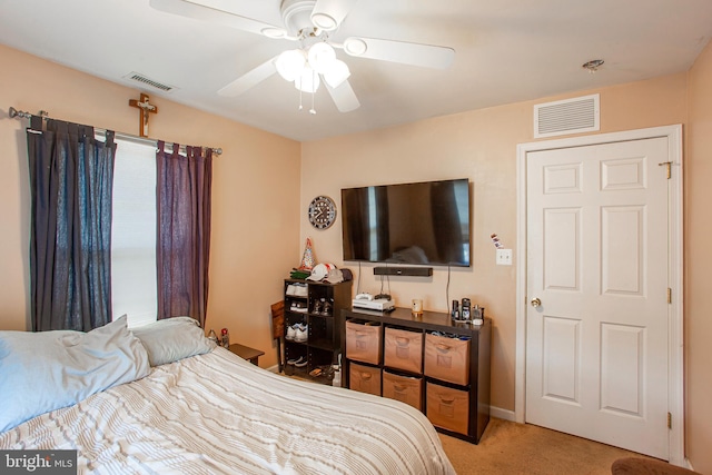 carpeted bedroom featuring ceiling fan