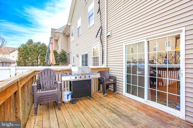 wooden terrace featuring area for grilling