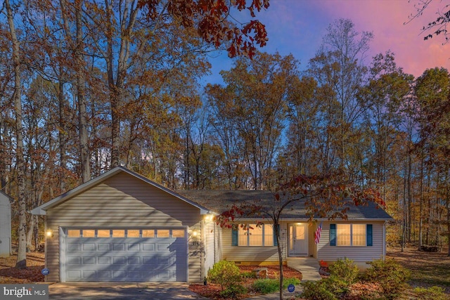 single story home with a garage