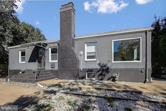 back of house with a patio