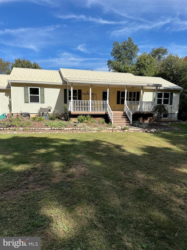 ranch-style house with covered porch and a front yard