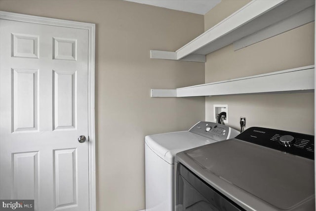 laundry room with independent washer and dryer