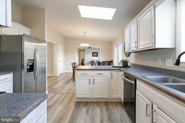 kitchen with white cabinetry, kitchen peninsula, lofted ceiling, light hardwood / wood-style flooring, and stainless steel range with electric cooktop