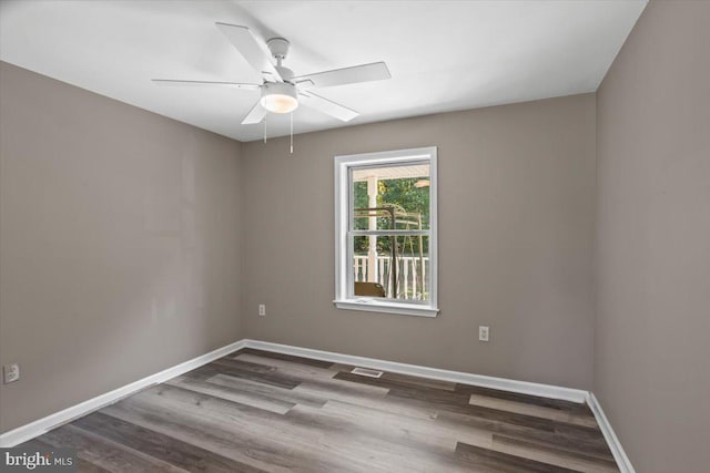 spare room featuring ceiling fan and hardwood / wood-style floors