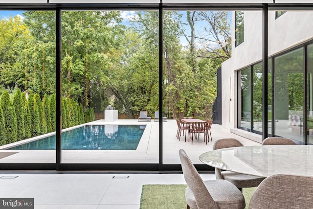 entryway with floor to ceiling windows