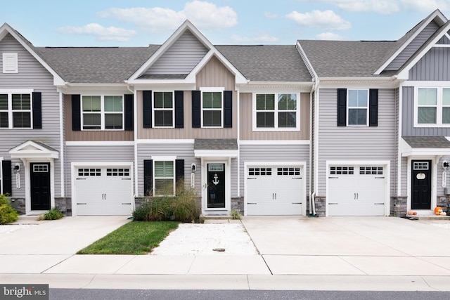 multi unit property featuring a garage