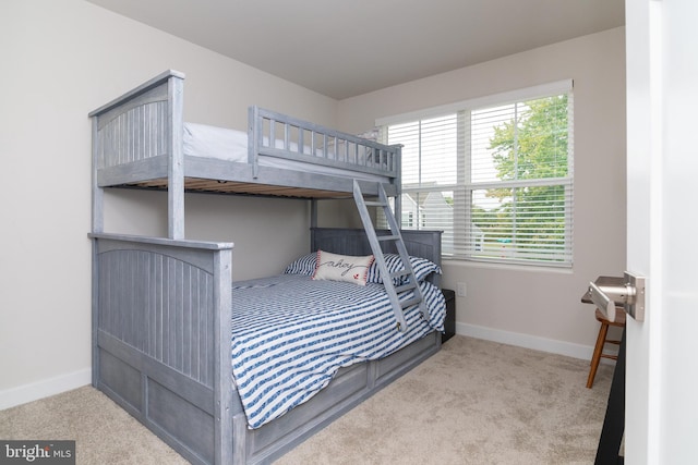 bedroom with light carpet