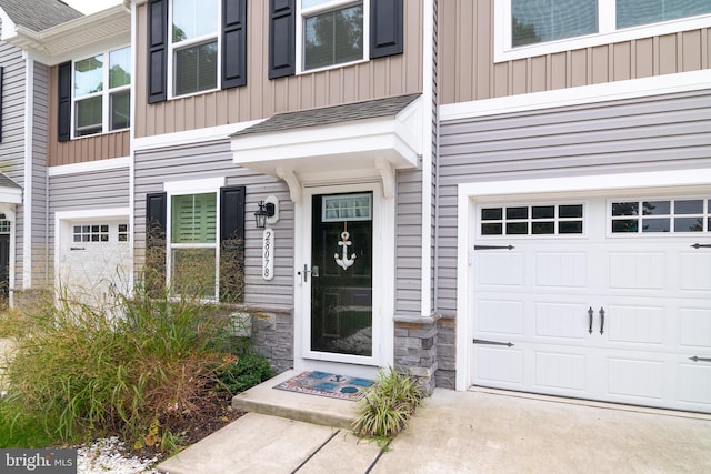 view of exterior entry featuring a garage