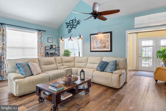 living room featuring high vaulted ceiling, ceiling fan, and dark wood-type flooring