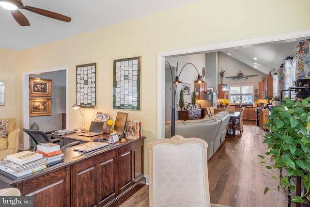 interior space featuring ceiling fan, dark hardwood / wood-style flooring, and lofted ceiling