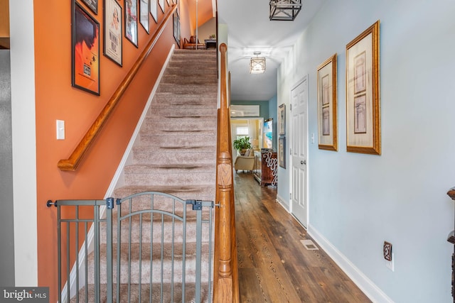 corridor with dark wood-type flooring