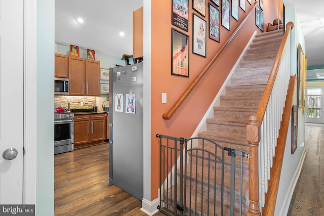 stairway with wood-type flooring