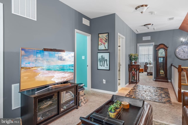 carpeted living room with vaulted ceiling