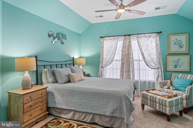 bedroom with ceiling fan, carpet floors, and lofted ceiling