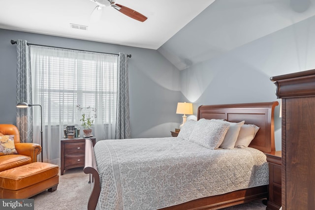 bedroom with carpet, vaulted ceiling, and ceiling fan