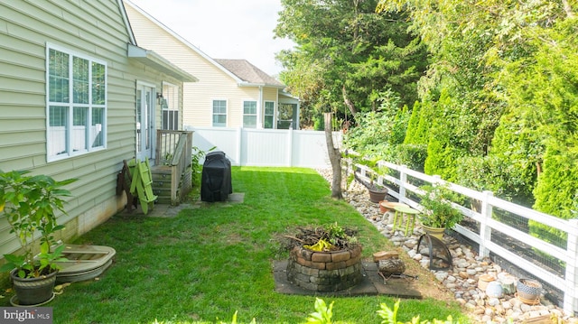 view of yard with a fire pit