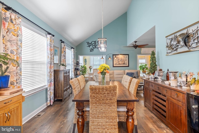 dining area featuring ceiling fan, wine cooler, dark wood-type flooring, and high vaulted ceiling