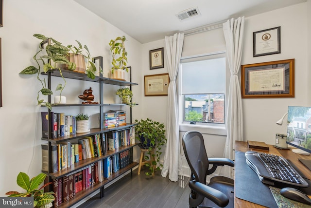 home office with hardwood / wood-style floors