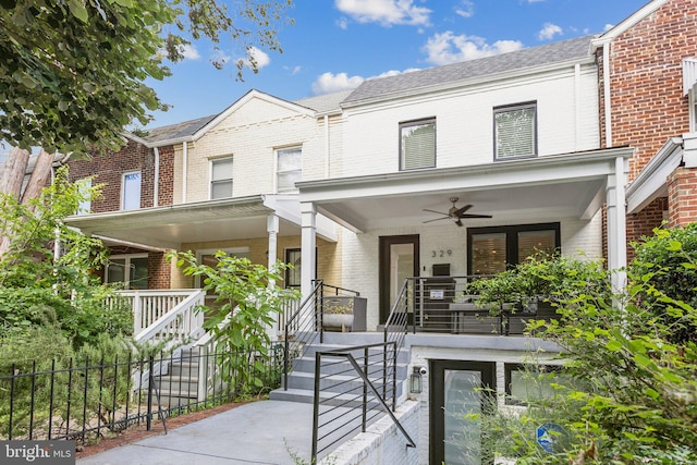 townhome / multi-family property featuring ceiling fan and a porch