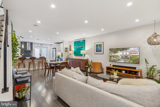 living room featuring dark wood-type flooring