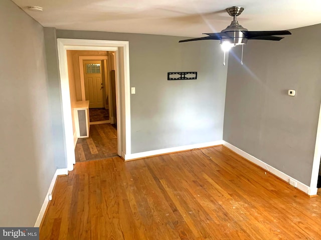 unfurnished room with wood-type flooring and ceiling fan