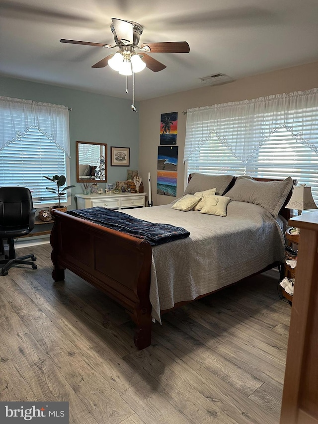 bedroom featuring hardwood / wood-style floors and ceiling fan