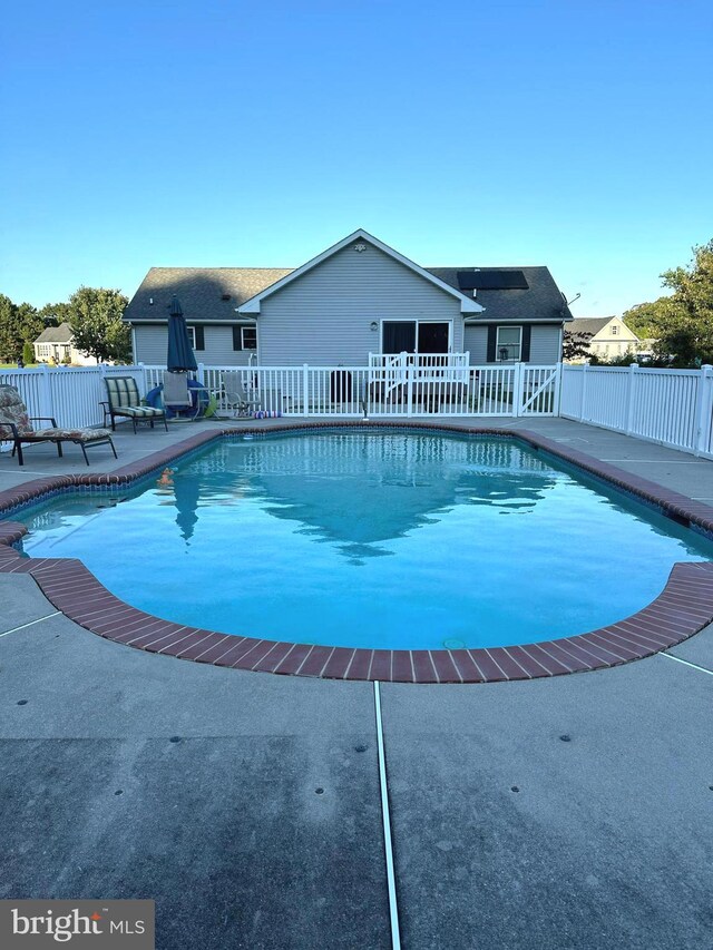 view of swimming pool with a patio