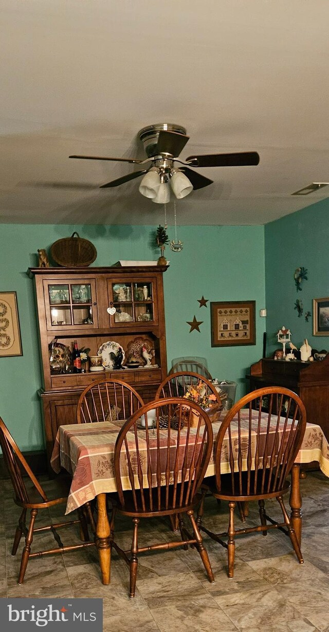 dining space featuring ceiling fan