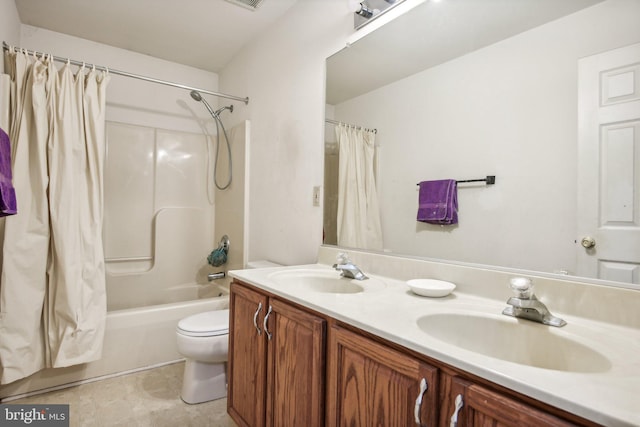 full bathroom with shower / bath combo, vanity, and toilet