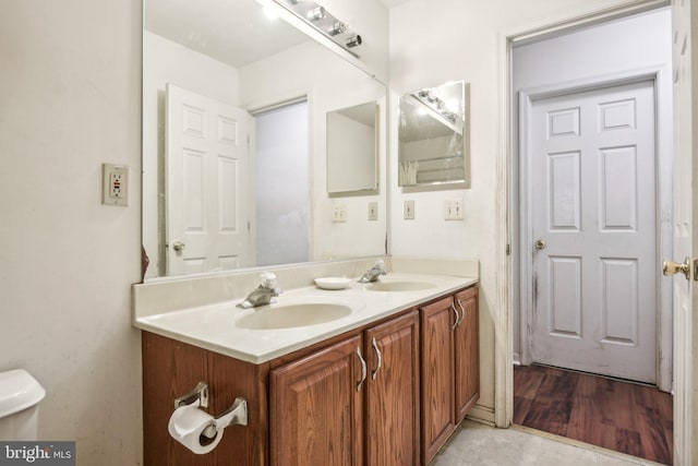 bathroom featuring vanity, toilet, and tile patterned floors