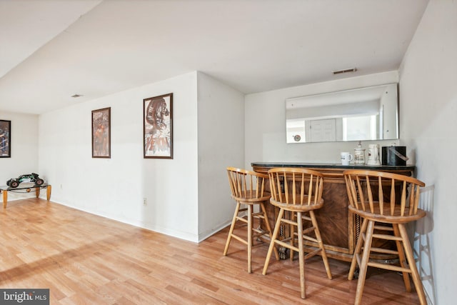 bar featuring hardwood / wood-style floors