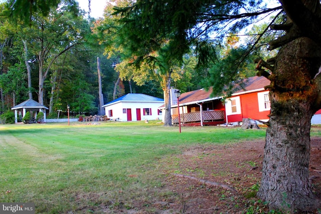 view of yard with a deck and a gazebo