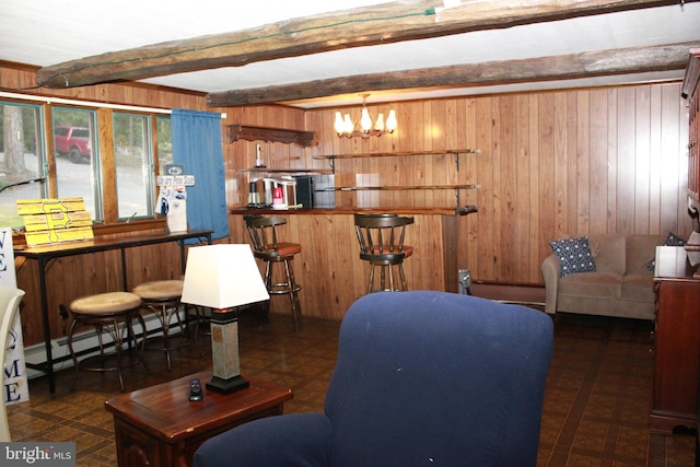 interior space with wood walls and beamed ceiling