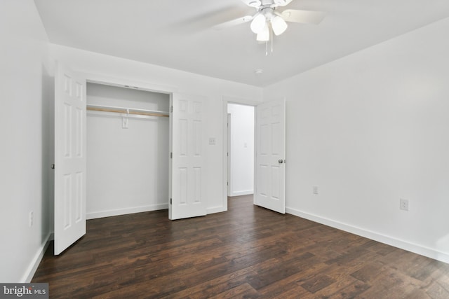 unfurnished bedroom featuring a closet, ceiling fan, and dark hardwood / wood-style flooring