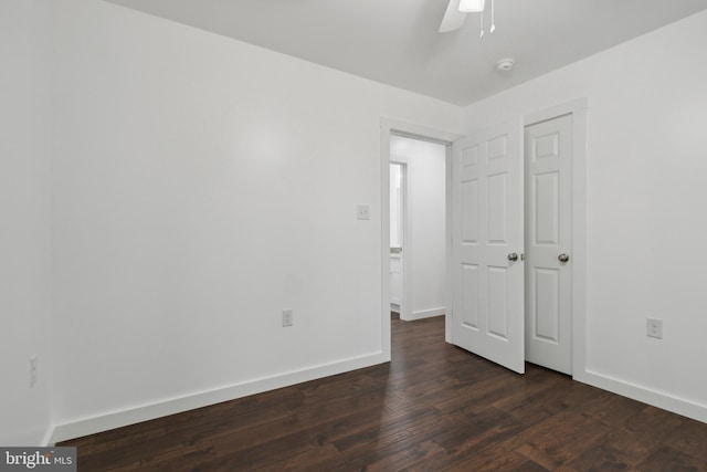 unfurnished bedroom with dark hardwood / wood-style flooring and ceiling fan