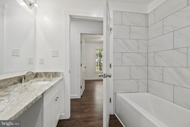 bathroom featuring hardwood / wood-style floors and vanity